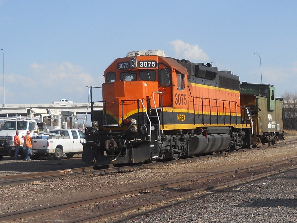 NREX 3075  27Feb2011  Idling at the yard office in Wichita Yard with BNSF 10715 (Caboose)